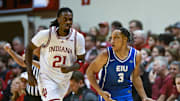 Eastern Illinois guard Nakyel Shelton (3) celebrates in front of Indiana forward Mackenzie Mgbako (21) after a made shot.  