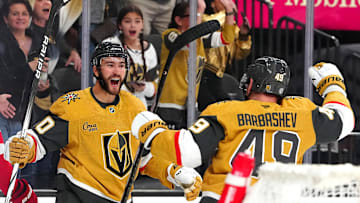 Mar 22, 2025; Las Vegas, Nevada, USA; Vegas Golden Knights center Nicolas Roy (10) celebrates with Vegas Golden Knights center Ivan Barbashev (49) after scoring a goal against the Detroit Red Wings during the first period at T-Mobile Arena. Mandatory Credit: Stephen R. Sylvanie-Imagn Images