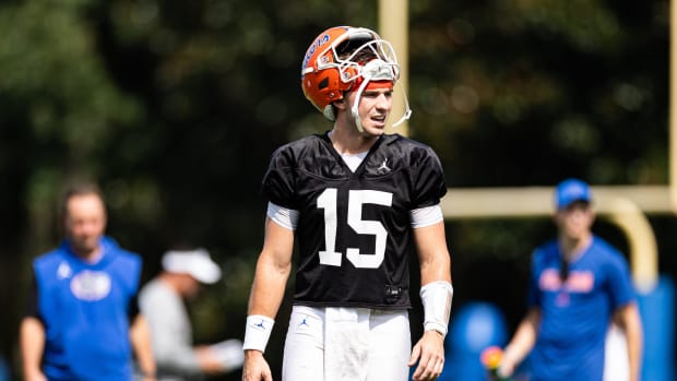 Florida Gators quarterback Graham Mertz (15) looks on with his helmet on his head during fall football practice