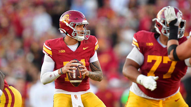 Nov 16, 2024; Los Angeles, California, USA; Southern California Trojans quarterback Jayden Maiava (14) drops back to pass aga