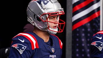 New England Patriots quarterback Drake Maye (10) walks to the field to warm up before the start of the game against the Buffalo Bills at Gillette Stadium. 