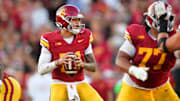 Nov 16, 2024; Los Angeles, California, USA; Southern California Trojans quarterback Jayden Maiava (14) drops back to pass against the Nebraska Cornhuskers during the second half at the Los Angeles Memorial Coliseum. Mandatory Credit: Gary A. Vasquez-Imagn Images
