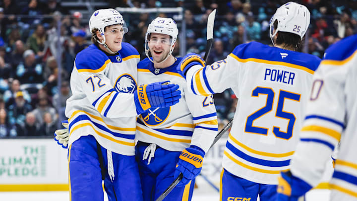 Buffalo Sabres players Tage Thompson, Mattias Samuelsson and Owen Power