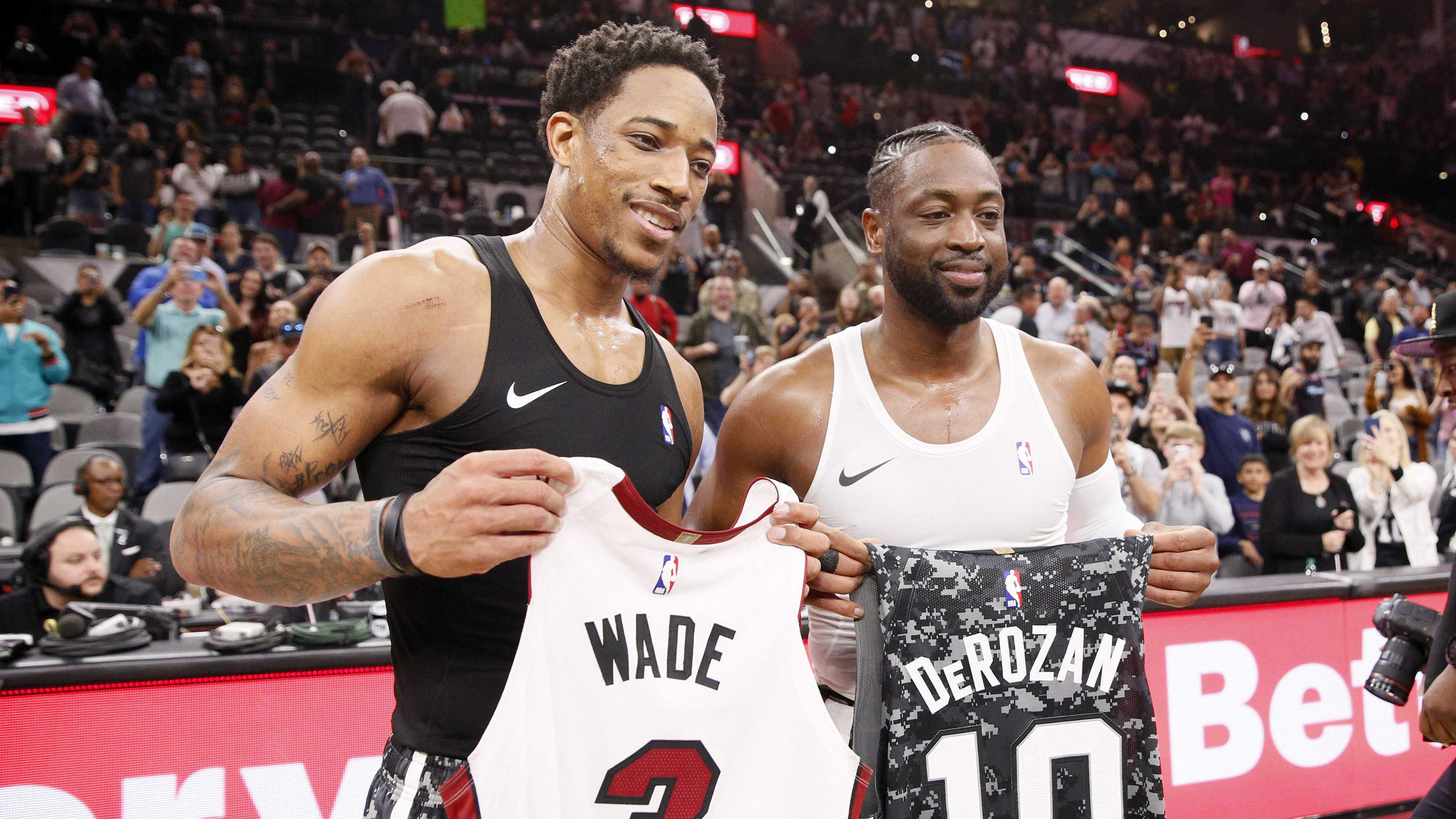 Mar 20, 2019; San Antonio, TX, USA; San Antonio Spurs shooting guard DeMar DeRozan (left) and Miami