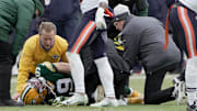 Green Bay Packers wide receiver Christian Watson (9) is tended to after sustaining a knee injury against the Chicago Bears.