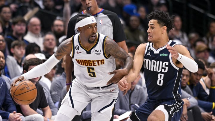 Nov 20, 2022; Dallas, Texas, USA; Denver Nuggets guard Kentavious Caldwell-Pope (5) and Dallas Mavericks guard Josh Green (8) in action during the game between the Dallas Mavericks and the Denver Nuggets at the American Airlines Center. Mandatory Credit: Jerome Miron-USA TODAY Sports