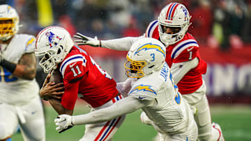 Dec 3, 2023; Foxborough, Massachusetts, USA; New England Patriots wide receiver Tyquan Thornton (11) runs the ball against Los Angeles Chargers safety Derwin James Jr. (3) in the second half at Gillette Stadium.