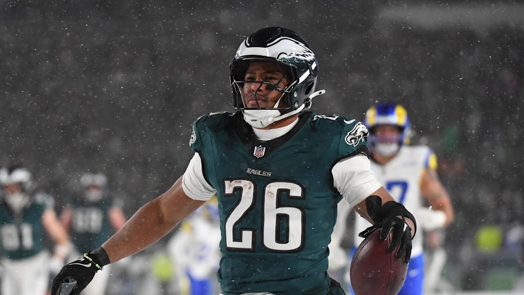 Jan 19, 2025; Philadelphia, Pennsylvania, USA; Philadelphia Eagles running back Saquon Barkley (26) celebrates after scoring a touchdown against the Los Angeles Rams in the second half in a 2025 NFC divisional round game at Lincoln Financial Field. Mandatory Credit: Eric Hartline-Imagn Images