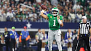 Nov 23, 2025; Arlington, Texas, USA; Philadelphia Eagles quarterback Jalen Hurts (1) throws the ball in the fourth quarter against the Dallas Cowboys at AT&T Stadium. 
