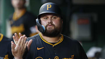 Jul 3, 2024; Pittsburgh, Pennsylvania, USA;  Pittsburgh Pirates first baseman Rowdy Tellez (44) high-fives in the dugout after scoring a run against the St. Louis Cardinals during the fifth inning at PNC Park. Mandatory Credit: Charles LeClaire-Imagn Images