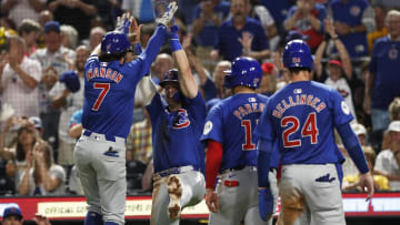 Aug 26, 2024; Pittsburgh, Pennsylvania, USA;  Chicago Cubs second baseman Nico Hoerner (LC) and third baseman Isaac Paredes (17) and right fielder Cody Bellinger (24) greet shortstop Dansby Swanson (7) crossing home plate on a grand slam home run against the Pittsburgh Pirates during the sixth inning at PNC Park.