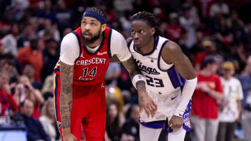 Apr 19, 2024; New Orleans, Louisiana, USA;  New Orleans Pelicans forward Brandon Ingram (14) and Sacramento Kings guard Keon Ellis (23) go for a rebound in the second half during a play-in game of the 2024 NBA playoffs at Smoothie King Center. Mandatory Credit: Stephen Lew-USA TODAY Sports