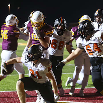 Ryle Raiders' Jacob Savage (21) scores a touchdown during the second half of the high school football game against neighborhood rivals Cooper Jaguars on Friday, Sept. 6, 2024, at Cooper High School. Cooper won 21-14.