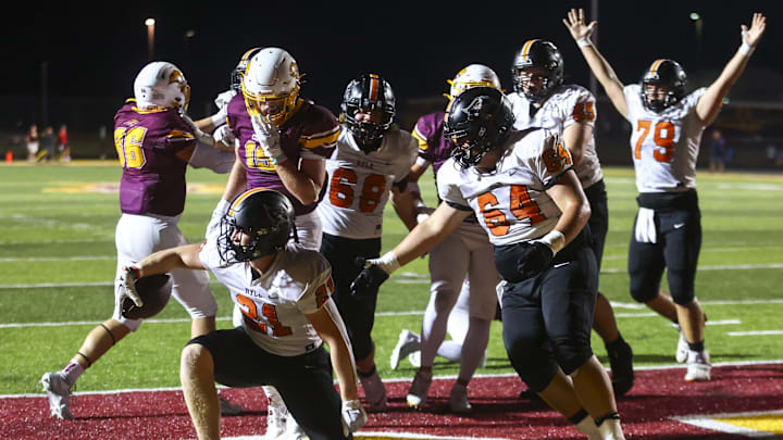 Ryle Raiders' Jacob Savage (21) scores a touchdown during the second half of the high school football game against neighborhood rivals Cooper Jaguars on Friday, Sept. 6, 2024, at Cooper High School. Cooper won 21-14.