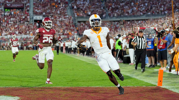 Tennessee Volunteers wide receiver Dont'e Thornton Jr. (1) scores a touchdown in front of Oklahoma Sooners defensive back Kani Walker (26) during a college football game between the University of Oklahoma Sooners (OU) and the Tennessee Volunteers at Gaylord Family - Oklahoma Memorial Stadium in Norman, Okla., Saturday, Sept. 21, 2024.