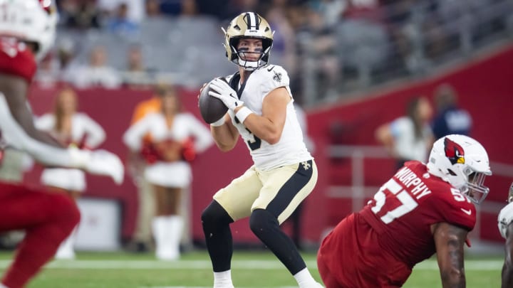 Aug 10, 2024; Glendale, Arizona, USA; New Orleans Saints quarterback Jake Haener (3) against the Arizona Cardinals during a preseason NFL game at State Farm Stadium. Mandatory Credit: Mark J. Rebilas-USA TODAY Sports