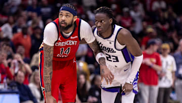 Apr 19, 2024; New Orleans, Louisiana, USA;  New Orleans Pelicans forward Brandon Ingram (14) and Sacramento Kings guard Keon Ellis (23) go for a rebound in the second half during a play-in game of the 2024 NBA playoffs at Smoothie King Center. 