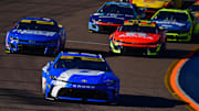 Nov 2, 2025; Avondale, Arizona, USA; NASCAR Cup Series driver Denny Hamlin (11) leads driver Kyle Larson (5) and driver William Byron (24) during the Cup Series Championship race at Phoenix Raceway.