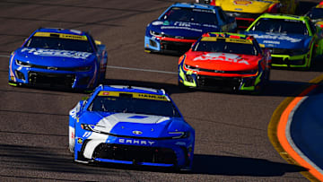 Nov 2, 2025; Avondale, Arizona, USA; NASCAR Cup Series driver Denny Hamlin (11) leads driver Kyle Larson (5) and driver William Byron (24) during the Cup Series Championship race at Phoenix Raceway.