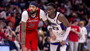 Apr 19, 2024; New Orleans, Louisiana, USA;  New Orleans Pelicans forward Brandon Ingram (14) and Sacramento Kings guard Keon Ellis (23) go for a rebound in the second half during a play-in game of the 2024 NBA playoffs at Smoothie King Center. Mandatory Credit: Stephen Lew-USA TODAY Sports