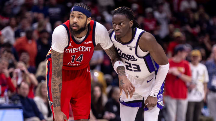 Apr 19, 2024; New Orleans, Louisiana, USA;  New Orleans Pelicans forward Brandon Ingram (14) and Sacramento Kings guard Keon Ellis (23) go for a rebound in the second half during a play-in game of the 2024 NBA playoffs at Smoothie King Center. Mandatory Credit: Stephen Lew-USA TODAY Sports