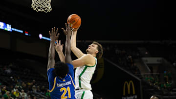 Oregon's Nate Bittle, right, goes up for a shot against UC Riverside’s Joel Armotrading during the second half at Matthew Knight Arena in Eugene.
