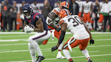 Dec 24, 2023; Houston, Texas, USA; Houston Texans tight end Brevin Jordan (9) catches a pass against Cleveland Browns safety Duron Harmon (30) in the second half at NRG Stadium.