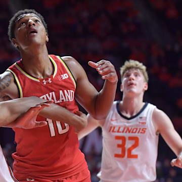Jan 23, 2025; Champaign, Illinois, USA;  Illinois Fighting Illini forward Carey Booth (0) and Maryland Terrapins forward Julian Reese (10) battle for position during the second half at State Farm Center. Mandatory Credit: Ron Johnson-Imagn Images