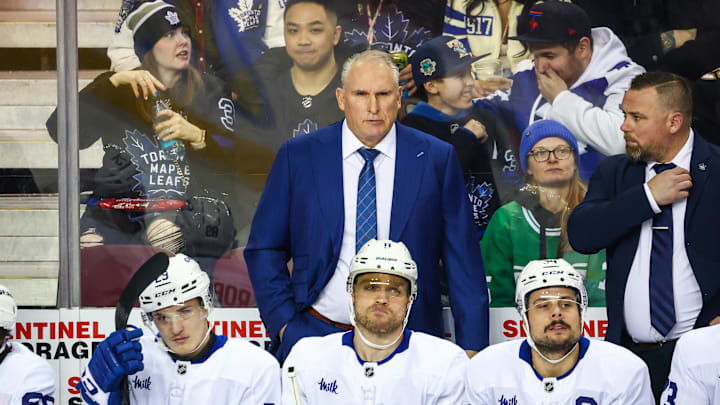 Feb 4, 2025; Calgary, Alberta, CAN; Toronto Maple Leafs head coach Craig Berube on his bench against the Calgary Flames during the first period at Scotiabank Saddledome. Mandatory Credit: Sergei Belski-Imagn Images