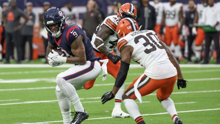 Dec 24, 2023; Houston, Texas, USA; Houston Texans tight end Brevin Jordan (9) catches a pass against Cleveland Browns safety Duron Harmon (30) in the second half at NRG Stadium.