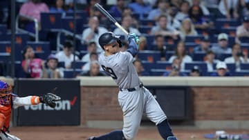 Jun 25, 2024; New York City, New York, USA; New York Yankees center fielder Aaron Judge (99) follows through on a grand slam home run during the eighth inning against the New York Mets at Citi Field. Mandatory Credit: Brad Penner-USA TODAY Sports