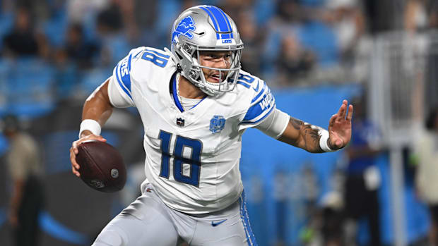 Detroit Lions quarterback Adrian Martinez (18) with the ball in the fourth quarter at Bank of America Stadium.