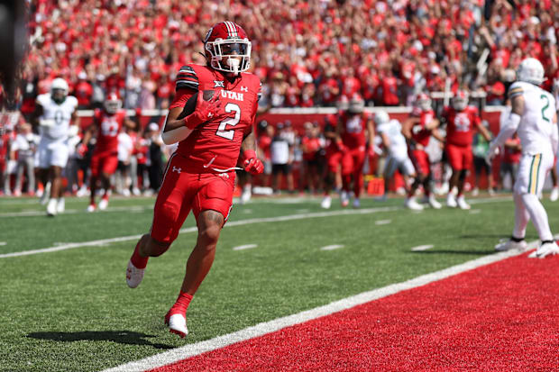 Utah running back Micah Bernard scores a touchdown this season.