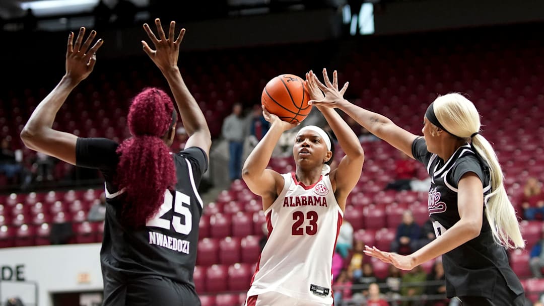 Jan 25, 2026; Tuscaloosa, AL, USA; Alabama guard Jessica Timmons (23) takes a shot between Mississippi State forward Favour Nwaedozi (25) and Mississippi State forward Madison Francis (40) at Coleman Coliseum. Mandatory Credit: Gary Cosby Jr.-Tuscaloosa News