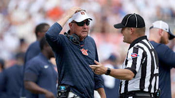 Sep 13, 2025; Auburn, Alabama, USA; Auburn Tigers head coach Hugh Freeze talks with a game official during the third quarter against the South Alabama Jaguars at Jordan-Hare Stadium. Mandatory Credit: John Reed-Imagn Images
