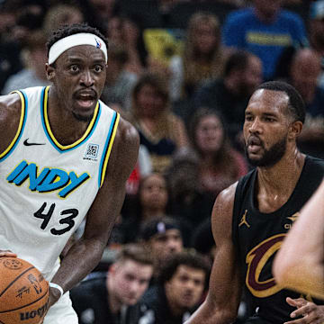 May 11, 2025; Indianapolis, Indiana, USA; Indiana Pacers forward Pascal Siakam (43) holds the ball while Cleveland Cavaliers forward Evan Mobley (4) defends during game four of the second round for the 2025 NBA Playoffs at Gainbridge Fieldhouse. Mandatory Credit: Trevor Ruszkowski-Imagn Images