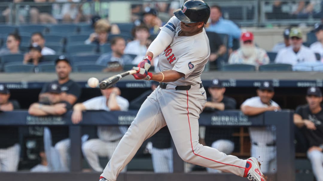 Jul 7, 2024; Bronx, New York, USA; Boston Red Sox third baseman Rafael Devers (11) singles during the second inning against the New York Yankees at Yankee Stadium. Mandatory Credit: Vincent Carchietta-USA TODAY Sports