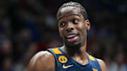 Dec 31, 2024; Lawrence, Kansas, USA; West Virginia Mountaineers guard Toby Okani (5) reacts during the second half against the Kansas Jayhawks at Allen Fieldhouse. Mandatory Credit: Jay Biggerstaff-Imagn Images