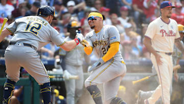 Jun 1, 2025; Philadelphia, Pennsylvania, USA; Milwaukee Brewers catcher William Contreras (24) celebrates after scoring run with first base Rhys Hoskins (12) during the seventh inning against the Philadelphia Phillies at Citizens Bank Park. Mandatory Credit: Eric Hartline-Imagn Images