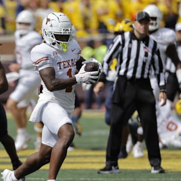 Sep 7, 2024; Ann Arbor, Michigan, USA; Texas Longhorns running back Quintrevion Wisner (26) rushes in the second half against the Michigan Wolverines at Michigan Stadium. Mandatory Credit: Rick Osentoski-Imagn Images