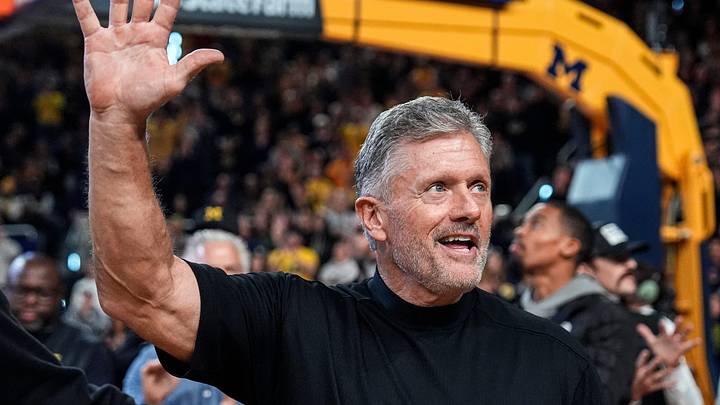 Michigan football head coach Kyle Whittingham waves at the crowd as he is being introduced on the floor during the first half between Michigan and USC at Crisler Center in Ann Arbor on Friday, Jan. 2, 2026.