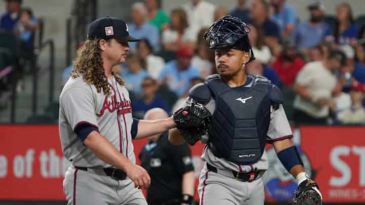 Jul 26, 2025; Arlington, Texas, USA; Atlanta Braves starting pitcher Grant Holmes (66) fist pumps catcher Drake Baldwin (30) after pitching the second inning against the Texas Rangers at Globe Life Field. Mandatory Credit: Raymond Carlin III-Imagn Images
