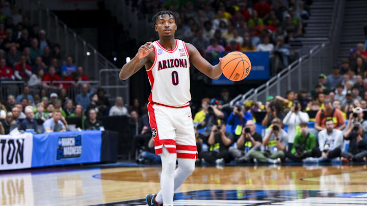 Mar 23, 2025; Seattle, WA, USA;  Arizona Wildcats guard Jaden Bradley (0) dribbles the ball against the Oregon Ducks in the second half at Climate Pledge Arena. Mandatory Credit: Steven Bisig-Imagn Images
