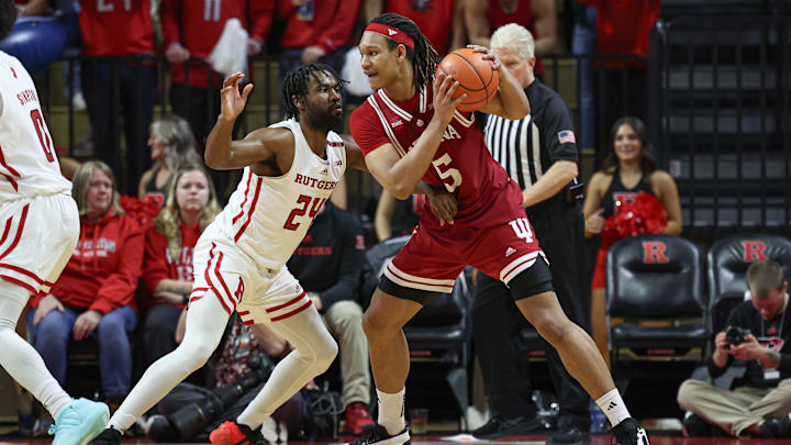 Indiana forward Malik Reneau (5) shields the ball from Rutgers guard Austin Williams (24) during a January 2024 game. Indiana forward Malik Reneau (5) shields the ball from Rutgers guard Austin Williams (24) during a January 2024 game.