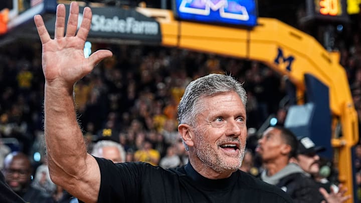 Michigan football head coach Kyle Whittingham waves at the crowd as he is being introduced on the floor during the first half between Michigan and USC at Crisler Center in Ann Arbor on Friday, Jan. 2, 2026.