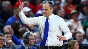 Mar 22, 2025; Wichita, KS, USA; Drake Bulldogs head coach Ben McCollum reacts after a play against the Texas Tech Red Raiders during the first half at Intrust Bank Arena. Mandatory Credit: Nick Tre. Smith-Imagn Images
