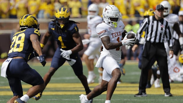 Texas Longhorns running back Quintrevion Wisner (26) rushes in the second half against the Michigan Wolverines at Michigan St