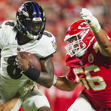 Sep 5, 2024; Kansas City, Missouri, USA; Baltimore Ravens quarterback Lamar Jackson (8) is tackled by Kansas City Chiefs linebacker Leo Chenal (54) and defensive end George Karlaftis (56) during the second half at GEHA Field at Arrowhead Stadium. Mandatory Credit: Jay Biggerstaff-Imagn Images
