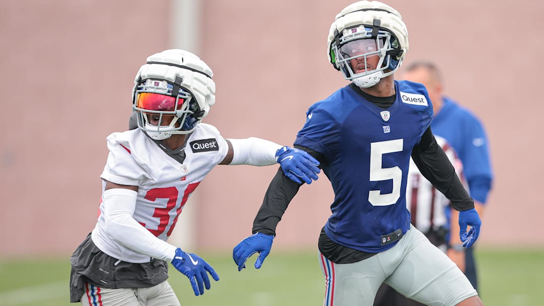Jul 24, 2024; East Rutherford, NJ, USA; New York Giants wide receiver Allen Robinson II (5) is defended by New York Giants cornerback Kaleb Hayes (38) during training camp at Quest Diagnostics Training Facility. Mandatory Credit: Vincent Carchietta-Imagn Images