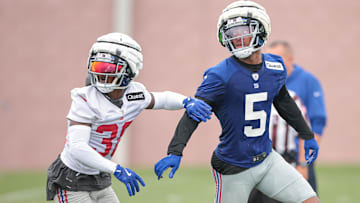 Jul 24, 2024; East Rutherford, NJ, USA; New York Giants wide receiver Allen Robinson II (5) is defended by New York Giants cornerback Kaleb Hayes (38) during training camp at Quest Diagnostics Training Facility. Mandatory Credit: Vincent Carchietta-Imagn Images
